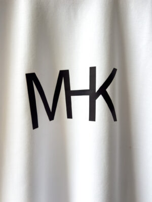 Close-up detail of the signature MHK graphic on the Ultra Heavy Signature White T-Shirt