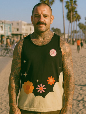 Model wearing the Flower Tank Top featuring retro floral artwork and lightweight performance construction.
