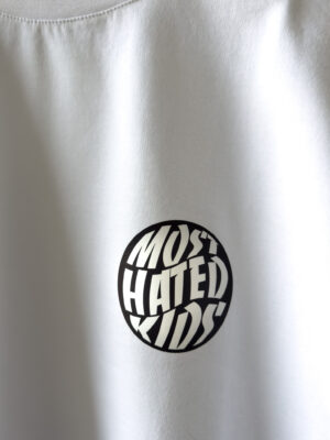 Close-up detail of the signature Most Hated Kids chest logo on the MHK Signature White T-Shirt